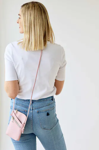 Model wearing Pale Pink Long Cross Body Shoulder Strap Bag By Archer House Available at Beetees Nelson